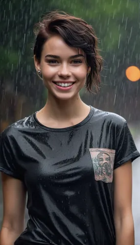 A beautiful teenage model with Latin features, from the front, arms in her pockets, with tattoos. in the rain, plain dark t-shirt, no prints, mix between Lena Headey and Audrey Hepburn, big smile, pla