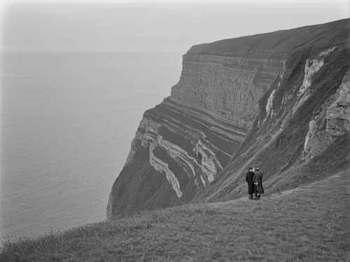 person standing near cliff,chalk cliff,cliffs of etretat,cliffs etretat,beachy head,jurassic coast,faroe islands,neist point,cliff top,north cape,cliff of moher,the cliffs,etretat,cliff coast,moher,cl