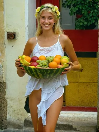 And so the light blonde young lady approached me like a goddess of love, smiling brightly and young and carrying the most amazing filled fruit bowl I have ever seen.,young lady in white dress holding 