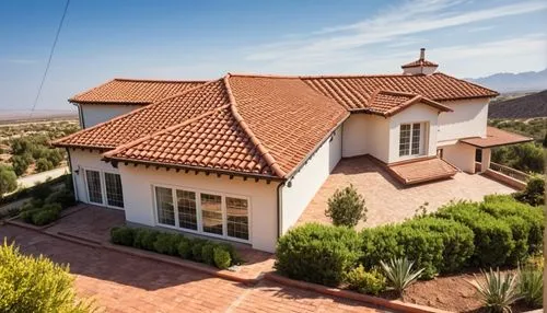 use the reference image to render my sketch, add realistic mission clay tiles on the roof and also ad a couple of chimneys. on a desert landscape,an aerial s of a home with a red tile roof and some tr