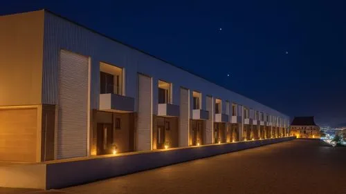 a large building with an empty parking lot in front of it,night view,akademie,fondazione,architekten,biozentrum,sachsenhausen,Photography,General,Realistic