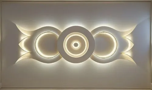 Gypsum decoration in the ceiling of a room with hidden LED lighting,a wall with a circular sculpture made out of white circles,foscarini,wall light,wall lamp,ceiling light,light sign,flavin,Photograph