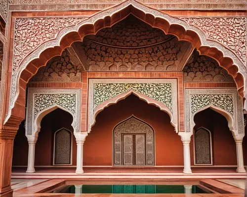 Intricate Islamic patterns, arches, domes, minarets, majestic entrance gates, ornate marble floors, intricate stone carvings, vibrant tile work, grand courtyards, serene water features, lush green gar