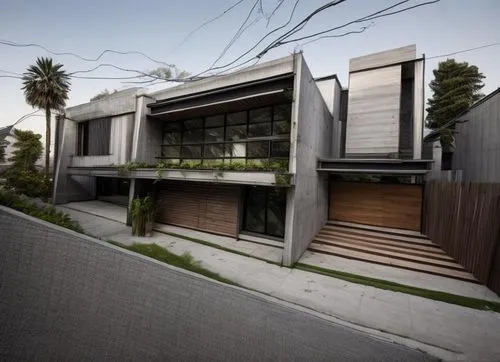 diseño exterior de una residencia estilo minimalista, con elementos de concreto, madera, cristal, rejilla de acero, vegetación, iluminación nocturna perfcetamente detallada, fotografia hiperrealista,a