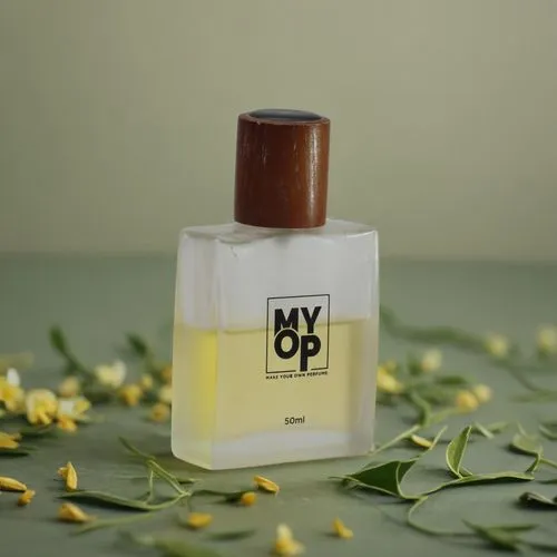 add a plain yellow background and a wavy style element behind the perfume bottle,a bottle of My Own Perfume with flowers surrounding it,parfum,natural perfume,perfume bottle,scent of jasmine,perfumery