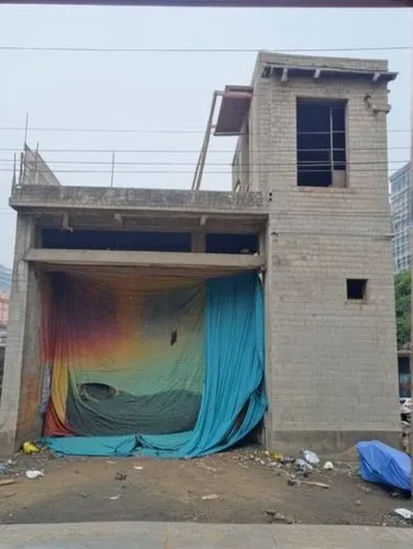 an open building with a covered entrance,facade insulation,facade painting,construction site,tarpaulins,abandoned building,renovation,Photography,General,Realistic