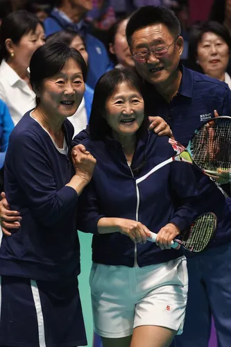 Zhang brought her mother Wang Feng Qin (left) and father Zhang Zhi Qiang (right) to Melbourne because she feared it could be her final top-level tournament.,rackets,table tennis racket,soft tennis,rea