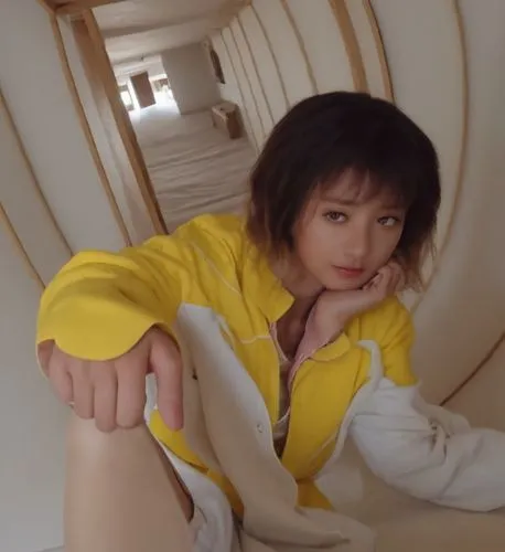 a woman posing for a pograph while leaning up against a wall,utada,jiarui,yellow jumpsuit,nanako,xiaoli,doona,ayami,ayumi,tsunku,hiromi,ninagawa,anri,massagetae,superorganism,asako,yellow,xiaoxi,jiaqi