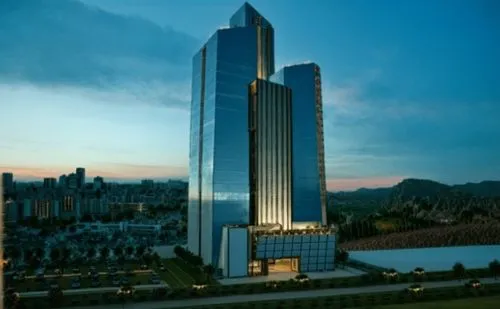 a futuristic building in the city with tall towers,rotana,azrieli,largest hotel in dubai,lanzhou,damac,abdali,Photography,General,Cinematic