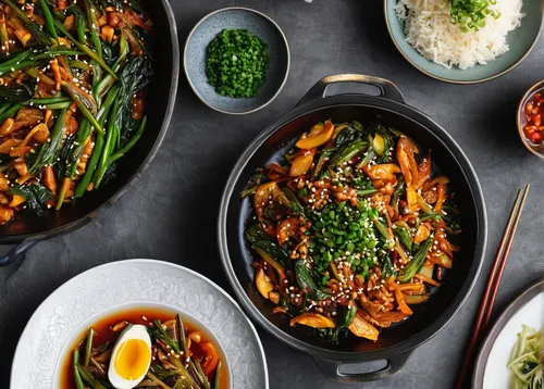 Create a heartwarming Korean side dish for a cozy family dinner tonight.,dak galbi,korean side dish,kimchi fried rice,jajangmyeon,korean spicy cabbage,japchae,kimchi jjigae,korean chinese cuisine,baek