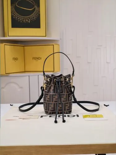 a brown and black purse on a table,louis vuitton,vuitton,handbags,yellow purse,bottega,handbag