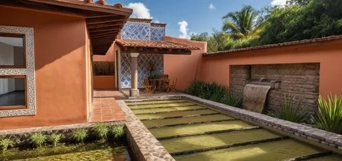 REMODELACIÓN DE UNA CASA ESTILO MEXICANO, CON ELEMENTOS DE LA ARQUITECTURA HACENDARIA DE MEXICO, DEL ESTADO DE PUEBLA,COLUMNAD REDONDAS, USO DE PECHOS PALOMA, TEJA, VIGAS DE MADERA, UN MURO CON CAIDA 