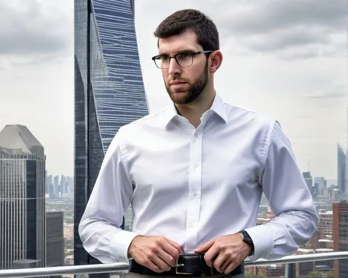 Andrew Luck, male architect, 35yo, bespectacled, short brown hair, casual smile, white dress shirt, dark blue formal pants, black leather belt, black dress shoes, holding a blueprint, standing in fron