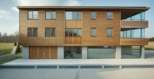 Groundfloor facade wood upper floors plaster white surrounding high resolution forst
,a home with two levels in the middle,timber house,modern house,passivhaus,wooden facade,wooden house,modern archit