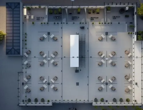 grey floor and white table,vienna's central cemetery,courtyard,the center of symmetry,view from above,beverly hills hotel,paved square,hotel complex,holocaust memorial,overhead shot,drone image,from a