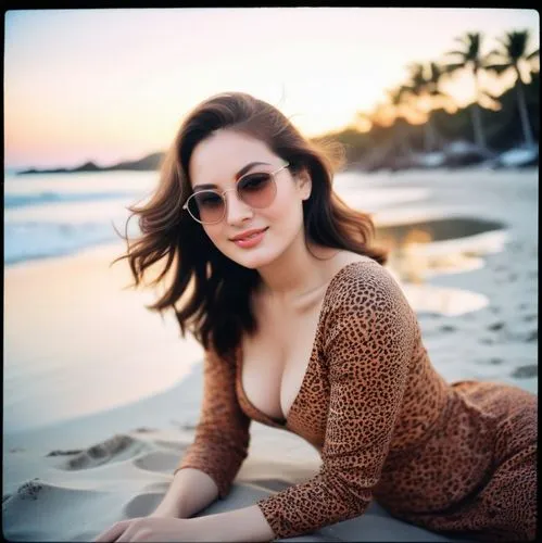 a woman on the beach in a dress and sunglasses,jennylyn,kareena,madhuri,tamanna,bareilles,beach background