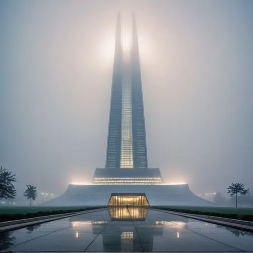 a skyscr with an illuminated entrance in front of it,lotte world tower,eckankar,brasilia,futuristic architecture,cairo tower,veil fog,calatrava,dubia,north american fog,esteqlal,skylon,triforium,high 