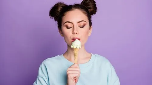 icecream,a woman eating ice cream on top of a stick,woman eating apple,woman with ice-cream,ice cream on stick,campanella,milka,lollypop