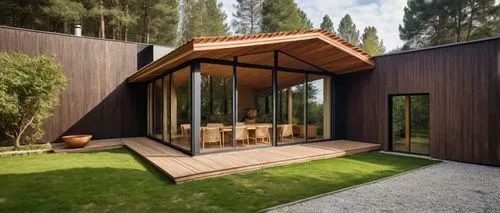 PALAPA ABIERTA HACIA EL EXTERIOR CON TECHOS DE MADERA Y CHIMENEA DE PIEDRA, RODEADA DE PASTO Y ARBOLES,modern glass and wooden house with a large lawn,inverted cottage,cubic house,wooden house,timber 