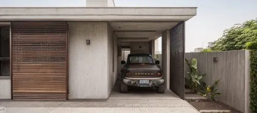 exposed concrete,underground garage,cubic house,residential house,mid century house,garage door,concrete construction,volkswagen brasilia,modern architecture,concrete blocks,cube house,dunes house,concrete slabs,folding roof,garage,build by mirza golam pir,concrete ceiling,brutalist architecture,land rover discovery,residential,Architecture,General,Modern,Natural Sustainability