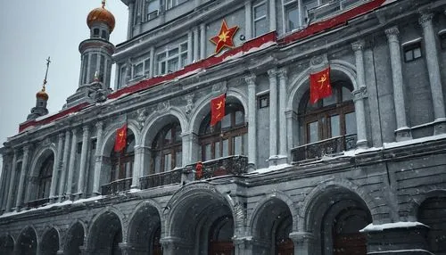 Soviet era architecture, grandiose buildings, imposing structure, ornate details, hammer and sickle symbols, red star decorations, intricate stonework, granite walls, massive columns, arched windows, 