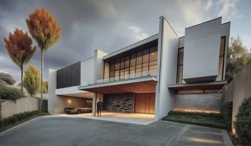 CONCRETO,the modern home is built with a large driveway and garage,seidler,modern house,modern architecture,mid century house,dunes house,neutra,eichler,cube house,cantilevers,corbu,mid century modern