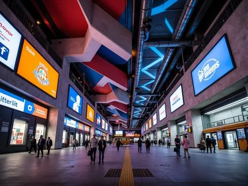 Vibrant bus station, expressionist architecture, bold geometric forms, abstract patterns, dynamic shapes, bright colors, futuristic curves, irregular lines, industrial materials, exposed pipes, concre