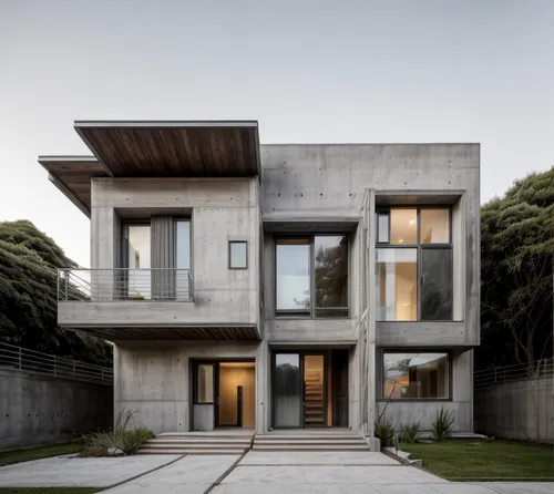 modern architecture,exposed concrete,modern house,cubic house,concrete construction,cube house,concrete,dunes house,reinforced concrete,concrete blocks,modern style,contemporary,house shape,archidaily