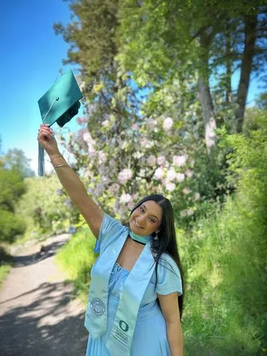 keep the dress as is but expand the surrounding background,hpnotiq,graduate,graduate hat,graduating,graduation cap,graduation day,graduation,to flourish,throwing leaves,with a bouquet of flowers,colle