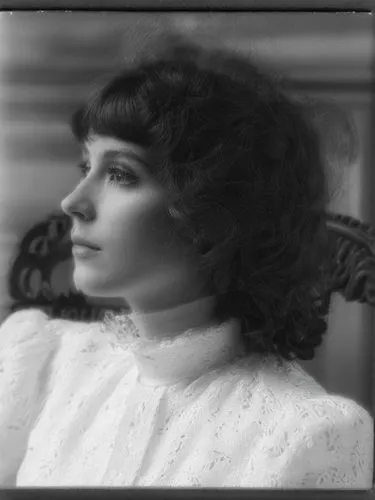 Black and white photo portrait of a lady, very close up.,a woman that is sitting down with a very beautiful face,vintage female portrait,yakimova,akhmatova,edwardian,colette,vintage woman,Photography,