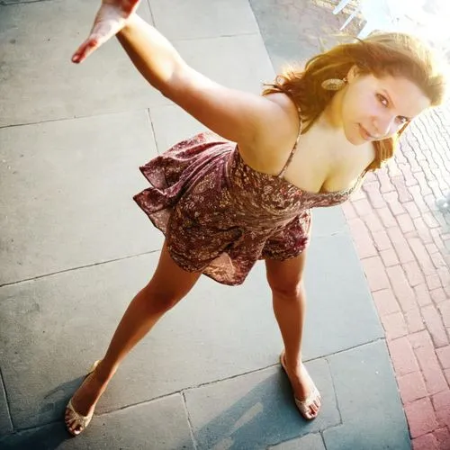 woman standing, legs spread, thick thighs, seen from above, high angle photography, short summer dress,street dancer,street performer,baton twirling,majorette (dancer),twirling,street performance,danc