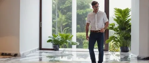 Modern interior design contractor, male, 30s, short brown hair, blue glasses, white shirt, dark jeans, tool belt, standing, indoor, luxurious villa, marble floor, elegant staircase, large windows, gre