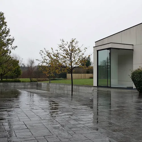 1building,a glass and metal building that is sitting on top of the ground,tugendhat,chancellery,quadriennale,glass facade,glass wall,glucksman