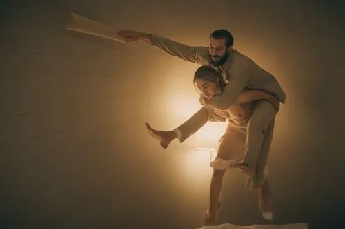 a naked woman is carrying a naked man on her back,man is holding up the woman in her arms,keersmaeker,two meters,scroobius,pilobolus,lubezki,matisyahu,Photography,Documentary Photography,Documentary P