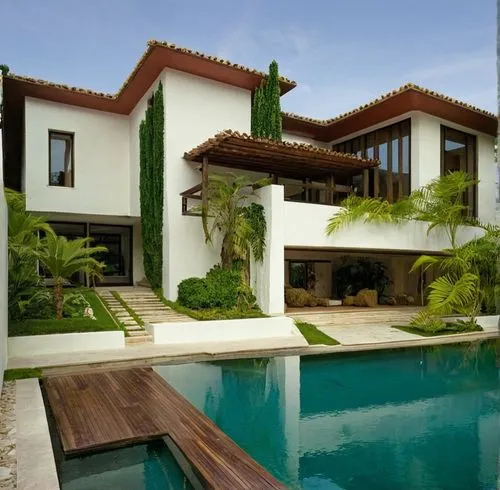 ESTERIOR DE UNA CASA RESIDENCIAL, CON UNA COCHERA AL FRENTE, CUBIERTA POR UNA LOSA QUE FORMA PARTE DE UNA TERRAZA EN PLANTA ALTA, ELEMENTOS DE LA ARQUITECTURA MODERNA MEXICANA MODERNA, CORRECCION DE E