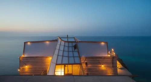 an image of the top of a building near the water,malaparte,cube stilt houses,snohetta,lifeguard tower,amanresorts,dunes house,house of the sea,rubjerg knude lighthouse,cubic house,lefay,zumthor,summer