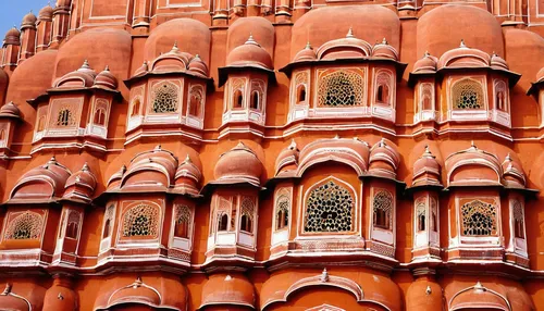 The outside of the Hawa Mahal, or Pink Palace in Jaipur, India,hawa mahal,jaipur,terracotta tiles,terracotta,new delhi,beautiful buildings,classical architecture,delhi,india,pink city,colorful facade,