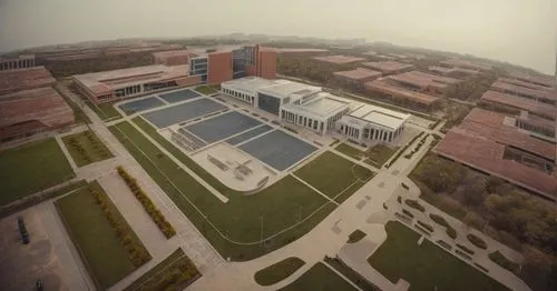 architecture new campus,aerial view of an industrial building, with several tennis courts and grass,biotechnology research institute,gvsu,schulich,uoit,umkc,iupui,Photography,General,Cinematic