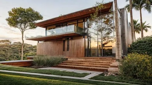 a home that is sitting on top of some grass,landscape design sydney,timber house,garden design sydney,dunes house,modern house,mid century house,Architecture,General,Modern,Mid-Century Modern