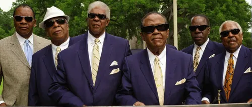 [Left to Right] Joey Williams, Benjamin Moore, Jimmy Carter, Paul Beasley, and Eric McKinnie are all members of the musical group The Blind Boys of Alabama. This group was founded in 1939 at the Alaba