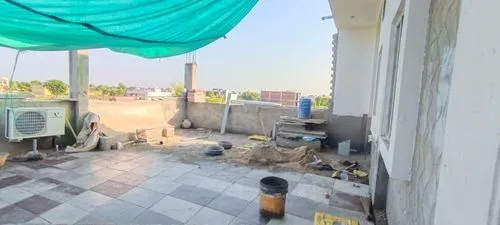 a blue sheet cover sitting on top of a roof,gachibowli,tindivanam,peruvanam,pallavaram,abhishekam,ongole