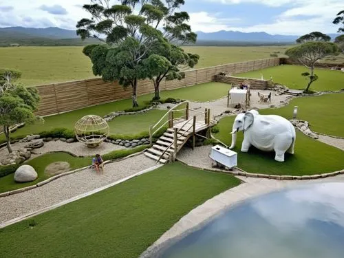 guacamayos people family
,the large elephant is on display with two smaller elephants in the grass,water elephant,landscape designers sydney,landscape design sydney,australia zoo,garden design sydney,