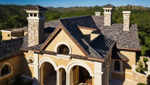 Ridge, cap, architectural shingles, luxury villa, steeply pitched roof, multi-angled, grand entrance, stone walls, lush greenery surroundings, overhanging eaves, decorative trusses, ornate chimneys, c