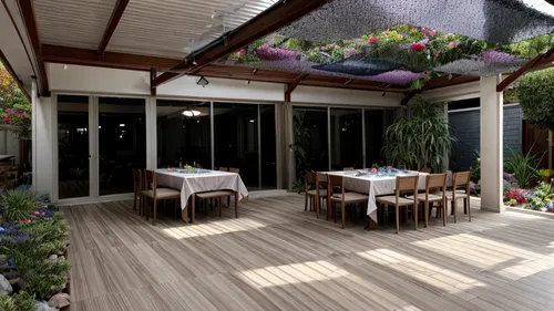 acuario de piso rodeado de arbustos con flores de colores, amoblar con mesas de mantel y personas en una fiesta de cumpleaños ,garden design sydney,verandah,landscape design sydney,verandahs,3d render