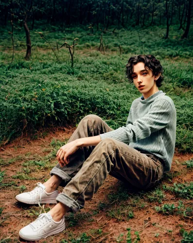 cross legged,earthy,string bean,garden shoe,styles,long bean,photo session in torn clothes,perched on a log,linen shoes,camo,boy model,male model,cargo pants,harry,khaki pants,forest man,gardener,gap kids,hiker,farmer in the woods