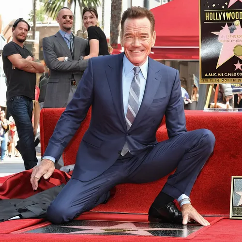 walk of fame,hollywood walk of fame,step and repeat,suit actor,leg,sit,footstool,cross legged,leg and arm on the piano,cross-legged,red socks,man on a bench,looking through legs,footmarks,no sitting,seated,kneeling,benedict,in seated position,high heel,Conceptual Art,Fantasy,Fantasy 20