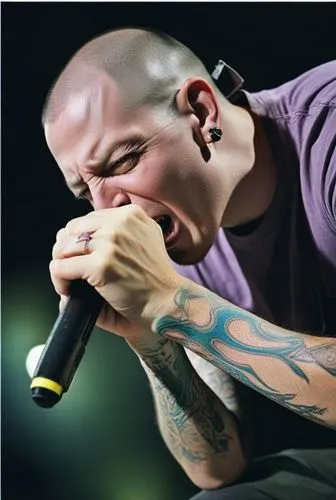 a man with many tattoos singing into a microphone,residente,draiman,chester,em,linkin,anselmo