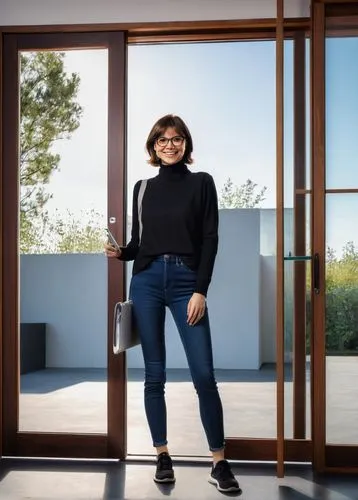 Modern designer, standing, smiling, bespectacled, short brown hair, casual wear, black turtleneck, dark blue jeans, sneakers, holding tablet, pencil, architectural design, harmonious door, wooden, gla