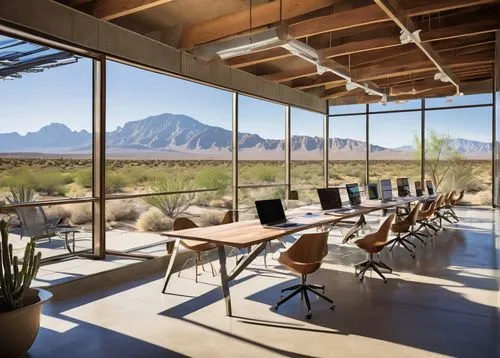 Modern architectural firm, Tucson desert landscape, low-rise building, large glass windows, steel frames, minimalist interior, sleek lines, industrial chic decor, green walls, living roofs, solar pane