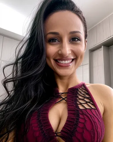 a woman is smiling while wearing a ,roimata,tiarra,chebli,suguna,santana,nalini